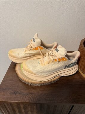 Hoka Peach Running Shoes with Orange Accents
